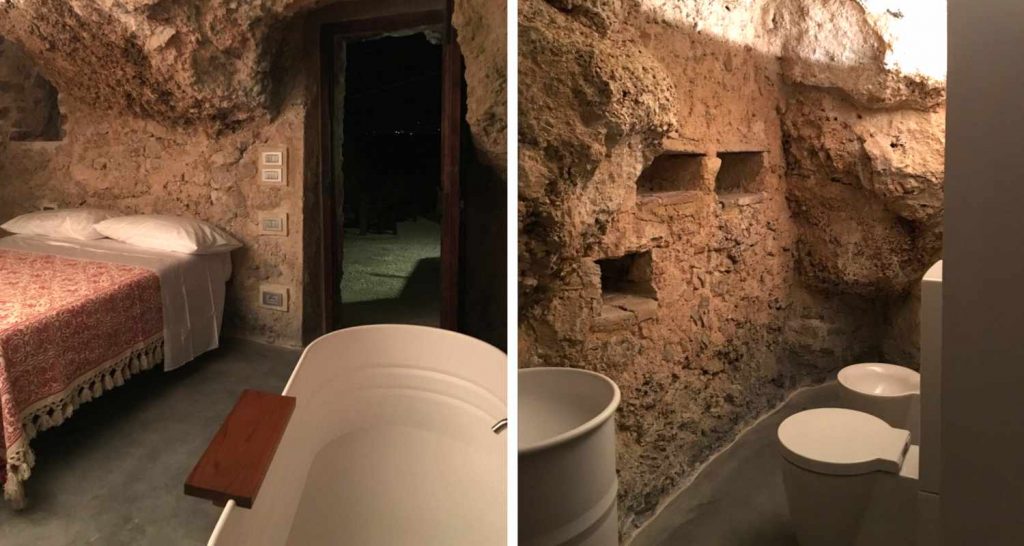 Piccolo fabbricato con una grotta scavata in roccia a Calascio (AQ) Camera con servizi realizzati nella grotta Progetto di recupero della OrianoAssociati Engineering